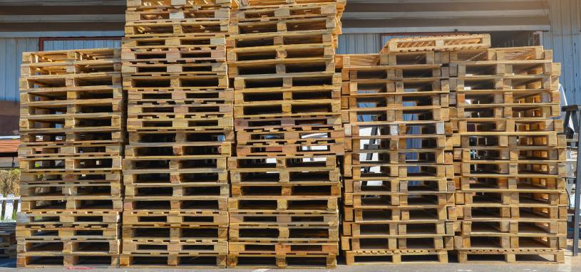 stacked second hand wooden pallets